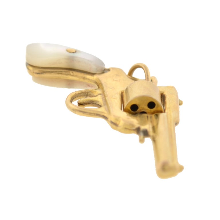 gold revolver with pearl handle