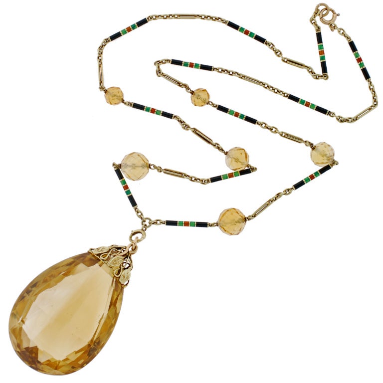 A fantastic and very unusual citrine necklace from the Late Art Deco (ca1930) era! This beautiful piece is comprised of a single large sized teardrop citrine that hangs from a 14kt yellow gold chain. The citrine teardrop has a faceted surface and