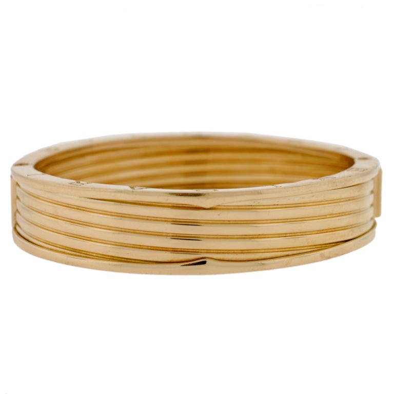 An absolutely fabulous vintage Bvlgari Bangle bracelet from the 1990’s! This gorgeous piece is made of vibrant 18kt yellow gold and displays a unique design. The gold is indented with lines that carry around the entire piece, giving the illusion of