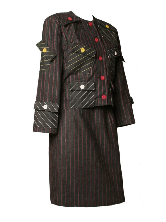 Comically update your work office while wearing this unique 1980's Patrick Kelly stripe set. Striking blazer features six pockets that are asymmetrically place at the center front and two pockets at the sleeves. Skirt features two side pockets and