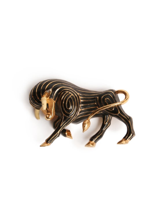 This charming little bull is sure to win you over as your statement jewelry piece for the season or for a lifetime.  This hollowed pin is demonstrative of an unusual channelling technique that gives the appearance of combed hair on the body of the