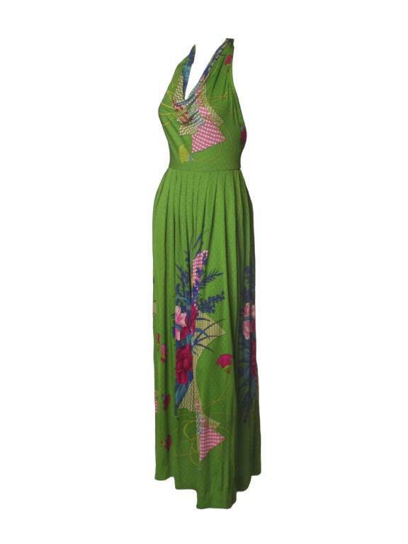 Expand your vintage style with this 1970’s Bolhan printed silk halter dress.  Pleated at the waist, this Halter dress creates perfect comfort and ease.  Perfect for sliping into this piece on warm-weather days for easy elegance. The dress is