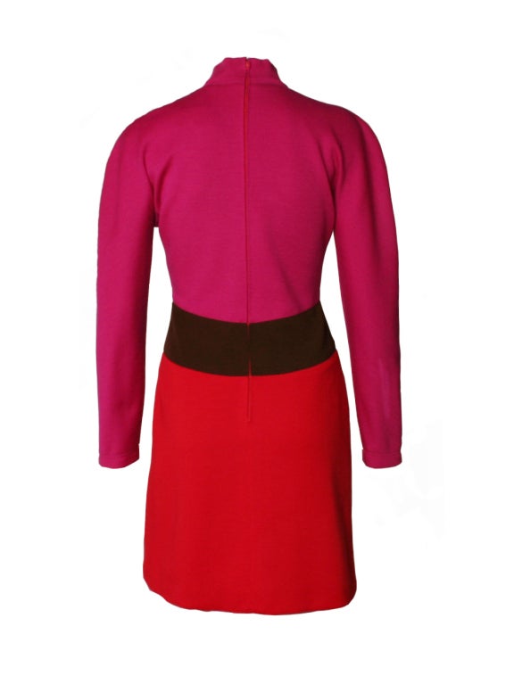 Oscar de la Renta's fuchsia dress and coat set is an effortless staple for this season's colorblock trend.  This set is a wonderful new-season choice, featuring a turtleneck mini dress and a matching oversize swing coat that are made out of striped