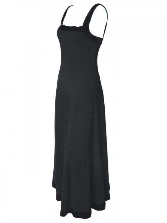 Add a touch of elegance to your wardrobe with this 1980's Chanel black sleeveless gown.  Trimmed in velvet, this 1980's Chanel black gown is the perfect way to amplify your black tie apparel.