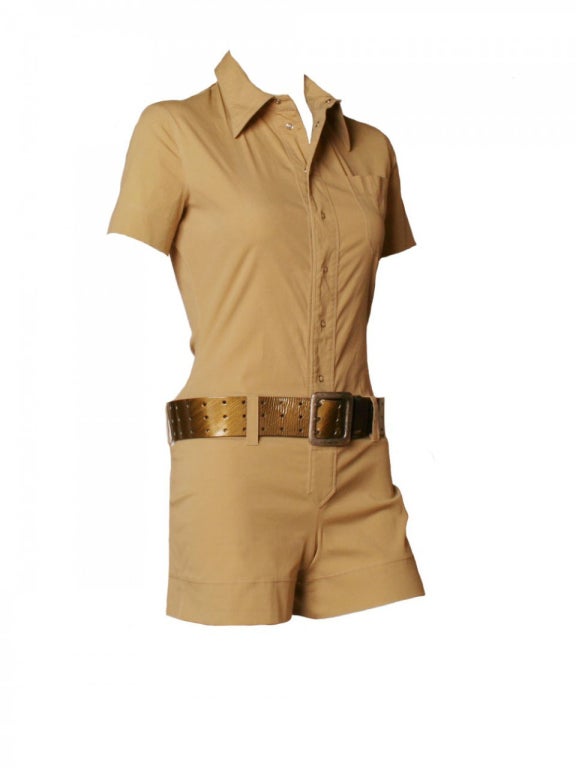 Channel cool and comfort with this 1990's Jean Paul Gaultier tan romper.  With a city-cool aesthetic, this Jean Paul Gaultier romper features a tan stretchy knit, snaps down the center front, collar and olive green belt.