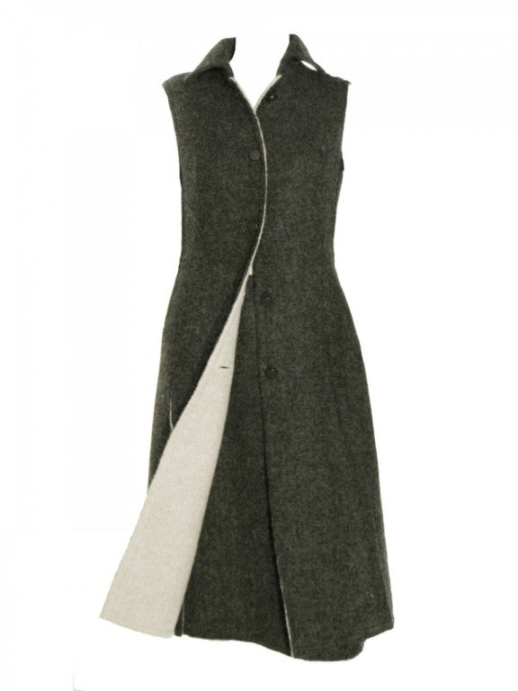 Add great sixties pieces to your wardrobe with this 1960's Givenchy wool cape and skirt set. Beautifully cut in grey wool, this Givenchy wool cape and skirt set features a grey wool cape with dark grey buttons down the center front and an A-line