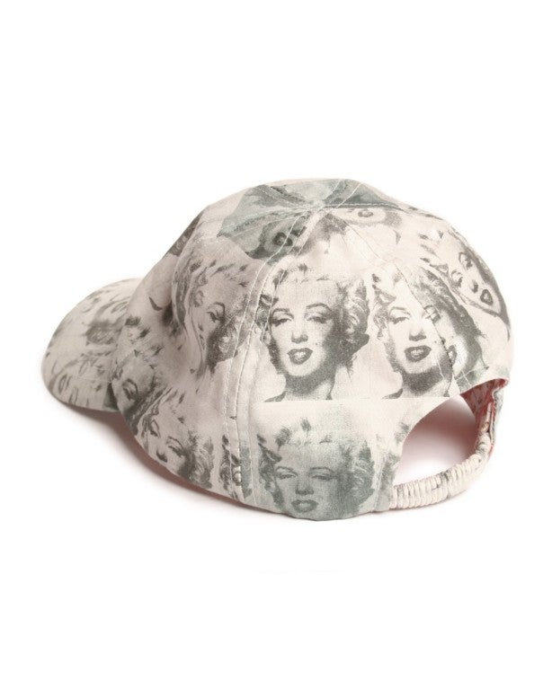 Throw out your snapback and add this unique Andy Warhol by Philip Treacy baseball cap to your spring wardrobe.  Completely inspired by Andy Warhol's Pop Artistry in his Marilyn Monroe painting, this cotton hat will make appearances on days other