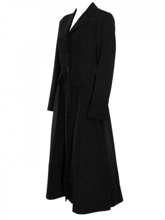 Made with the idea that a body's figure should be shown no matter what, Alaïa deisgned this buttoned sweeper coat with two front pockets and a back slit.  What makes this coat special is because in the 80's when androgyny was so popular, Alaïa