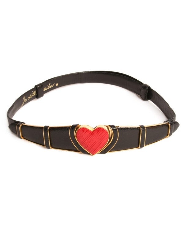 Show your love for Judith Leiber in this snakeskin black belt with heart buckle.  A perfect piece to add flare to an outfit, or give your LBD a pop of color with a familiar shape.  Wear it with your favorite LBD.  Belt extends from 25
