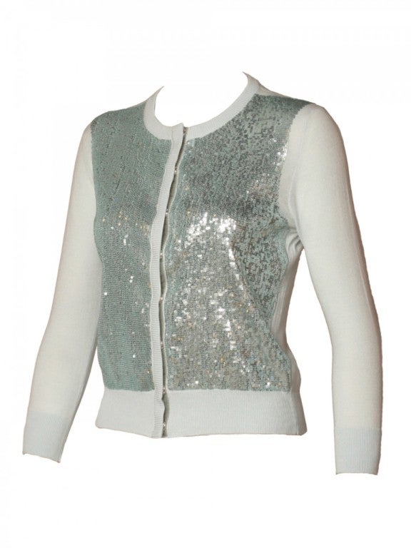 Be a star in this subtle yet bold L´Wren Scott baby blue sequin cardigan.  Celebrities from Mick Jagger to Michelle Obama are in love with L´Wren Scott's fashion, so why not you too?  Take this piece with you for those emergency rainy days.