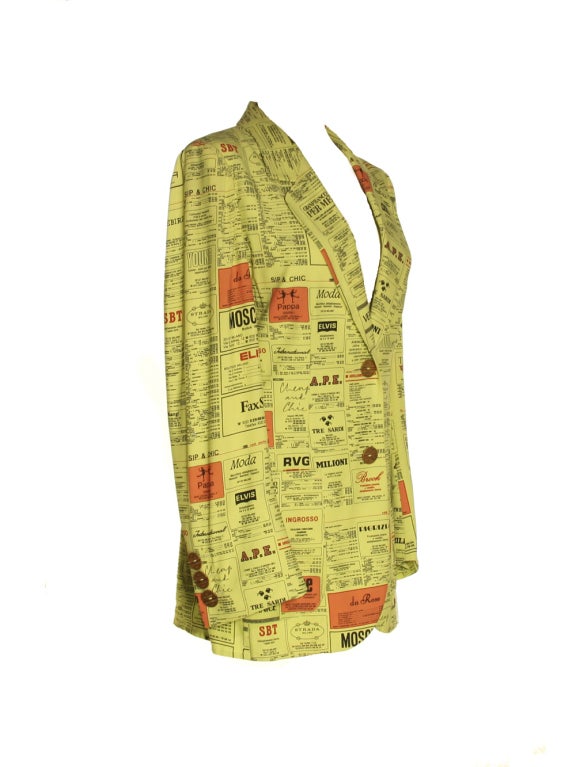 The original bad boy of fashion satire creates another priceless piece with this 1990s Moschino Cheap and Chic yellow pages print blazer.  This blazer pokes at fashion's biggest designer names by parodying their names and logos as they might be