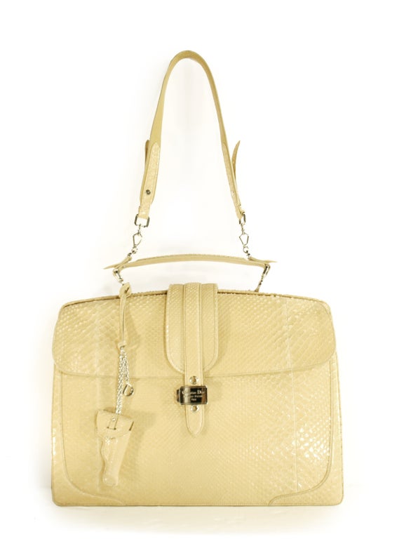 Straight from the Spring/Summer 2010 Runway and into your heart, this Christian Dior beige python detective briefcase bag is the classic luxury piece that will illuminate your wardrobe for decades to come. To say that this bag is of superior quality