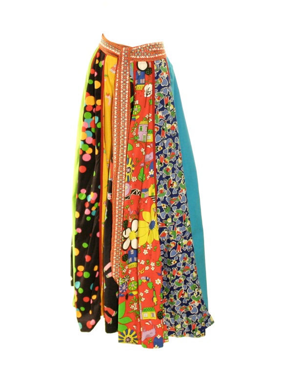 Let your fun and playful side shine when in this 1970's Giorgio di Sant'Angelo colorful, multi-print, cotton maxi-skirt.  The full A-line shape is created with various godet panels of various prints.  Red piping separates each panel.  The posterior