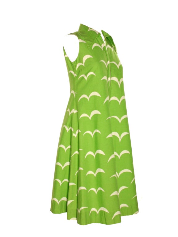 Heads will be turning as everyone sneaks a peek at this Marimekko lime green and white shift dress from 1974. Little do they know how comfortable your dashing ensemble is. Hitting the fashion scene in the 1960s and 1970s, Marimekko launched to