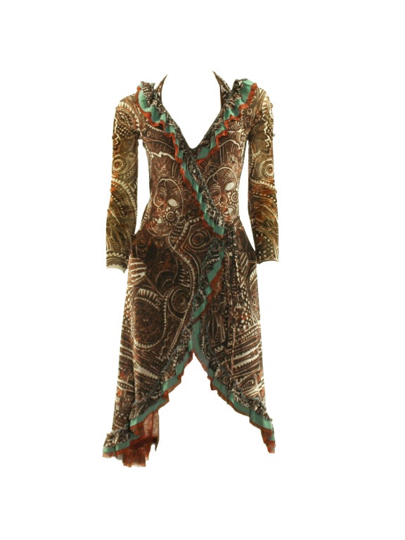 Let the pool deck be your own personal catwalk while in this Jean Paul Gaultier brown and turquoise, tribal print, bikini and matching wrap dress.  The seductive bikini is made of a brown and creme, perforated tribal print material.  The triangle