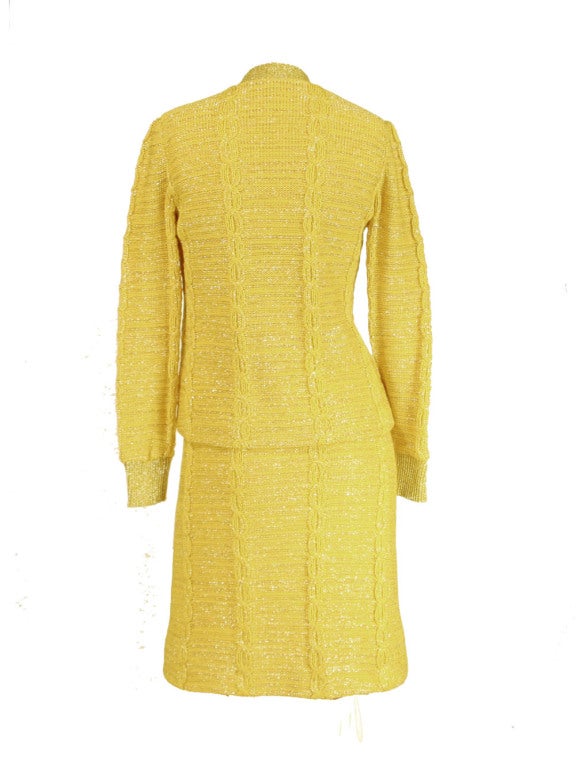 Be the golden girl of high society fashion in this 1960's Oscar de la Renta yellow and gold, knit, sweater dress and matching cardigan set.  In mint condition, this set by noted designer de la Renta shines brighter than the sun with the help of the