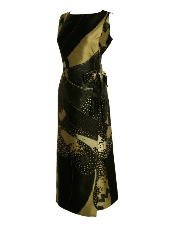 Get inspired by the casual yet glamorous style of the 1960s with this Galitzine silk, black, tan, and cream, multi-print, tunic dress.  This sophisticated dress is made of a superior quality raw silk.  It is dyed with a black, tan, and cream