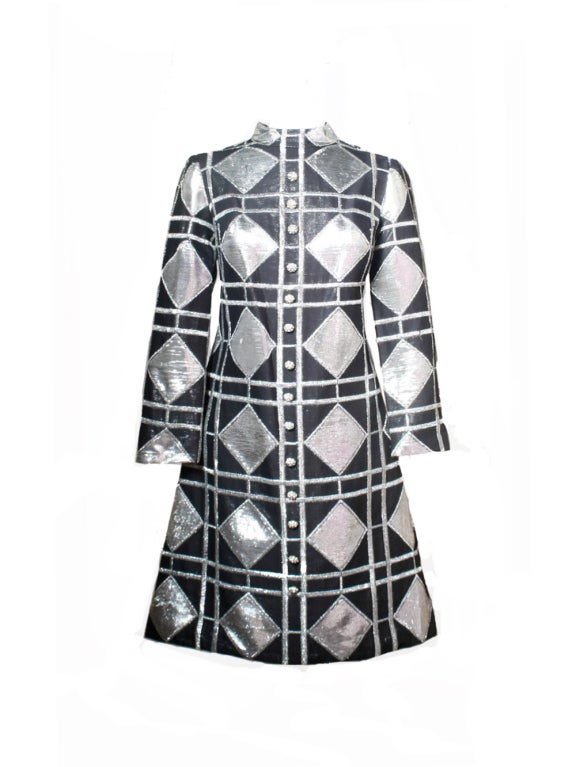 The swinging sixties are back in full swing when you wear this Eloise Curtis for David Styne silver metallic and black lurex, mod style dress from the 1960's.  The silver lattice and diamond pattern is created with meticulous stitching of silver and