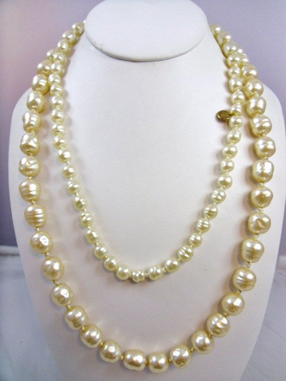Ultra chic CHANEL Graduated Baroque Pearl Rope signed and Dated 1981.  This 44 inch long stunning necklace will layer up with others or work alone. It has no clasp, just throw over the head and go!  A marvelous necklace and staple in any Chanel