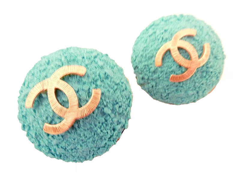 I’ve never seen Chanel earrings like these with a rough sand-like 3-dimensional carving in a dome shaped gold-tone setting.  In excellent condition, these clip earrings measure 1 ½” in diameter and are signed Chanel 93C Made in France.