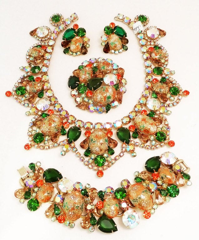 This collectible Bookpiece vintage Juliana parure features the famous Easter Egg design in corals, citrines and topaz colors in a gold-tone setting. It is rare to find the whole parure because most sets do not have the rare pin. The Juliana necklace