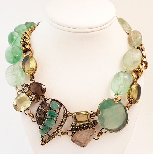 Iradj continues to out-due himself with each piece he creates.  This outstanding piece features pink Quartz and green peridot with citrine, topaz and lavender precious accents in a gold-tone setting.  This necklace measures 22? long with a hook