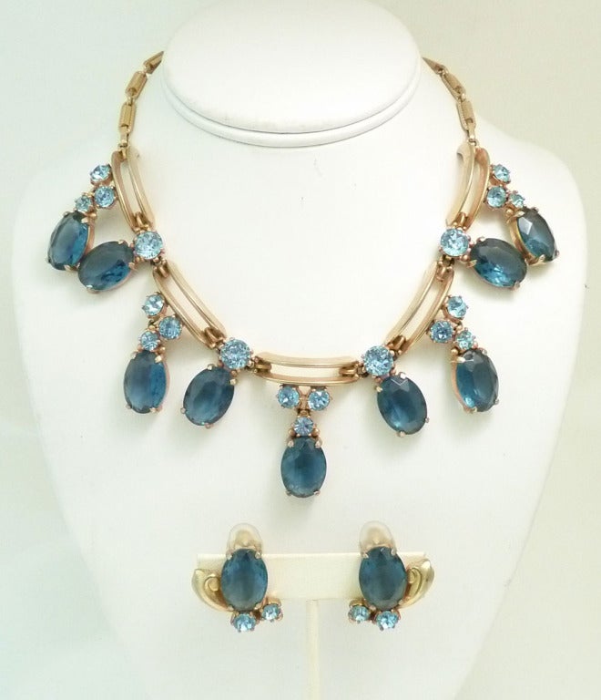 I knew the set existed, but I had never seen it before.  It is pure elegance and when you wear it you and your friends will know its special.  This vintage signed Schiaparelli set features dark and light blue rhinestones in a gold-tone setting.  The