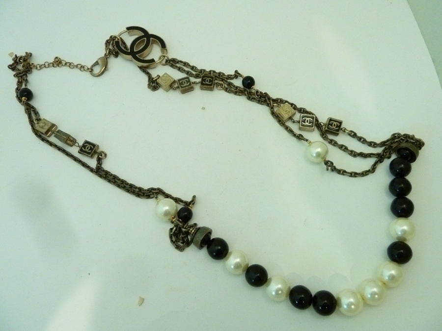Vintage Signed Chanel Logo Multi-Strand Chain & Faux Pearl Necklace In Excellent Condition In New York, NY