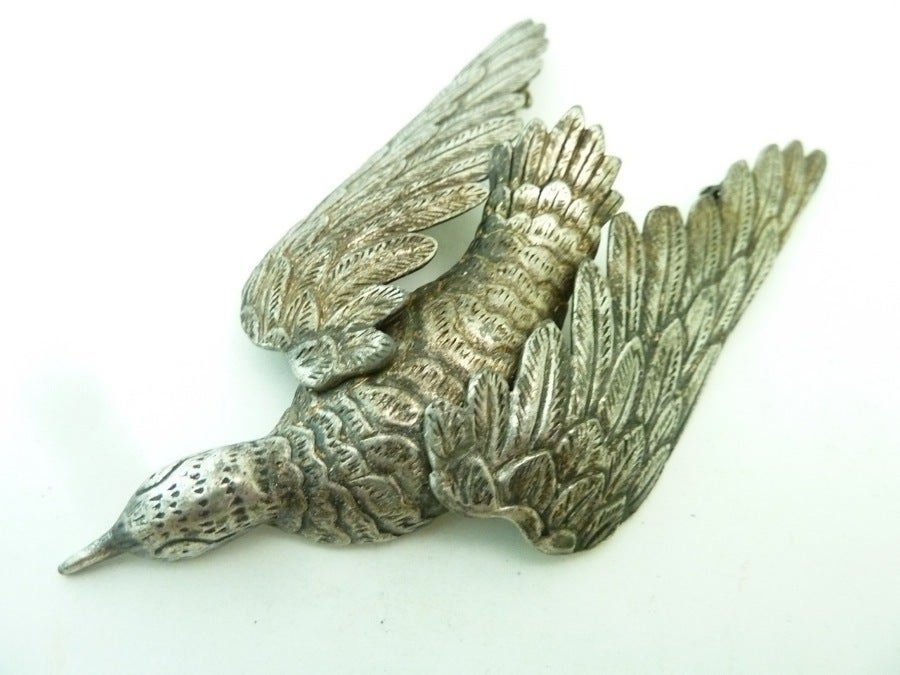 One of the rare finds from the respected company Authentics comes this great masterpiece. It is very, very special. This large vintage deco 1940’s Authentics pin features an intricate carved bird with moveable wings that spread into any size pin you