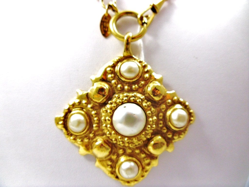 Chanel Hammered Gold Pendant Necklace.  Great for day or evening. Smooth pearls completed with a formidiable pendant makes this a show stopper look for any occasion.