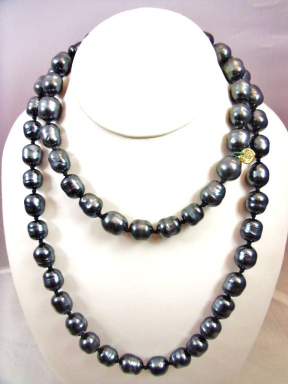 Continuous (no latch) Chanel Gunmetal Long Rope Necklace, Signed and Dated 1981 on Hang Tag.  Bright Luster to these 11mm pearls.  Makes a statement alone or mixed with other pearls or crystals.  60 inches long.  A phenomenal necklace!