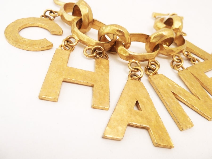 A famous Chanel charm bracelet that is always in demand, it features the Chanel name as charms in a mottled gold-tone setting. This piece measures 8 ½” with a toggle bolt closure; a single N is 1 ½” x 1 1/8”.  This bracelet is signed Chanel 93P Made
