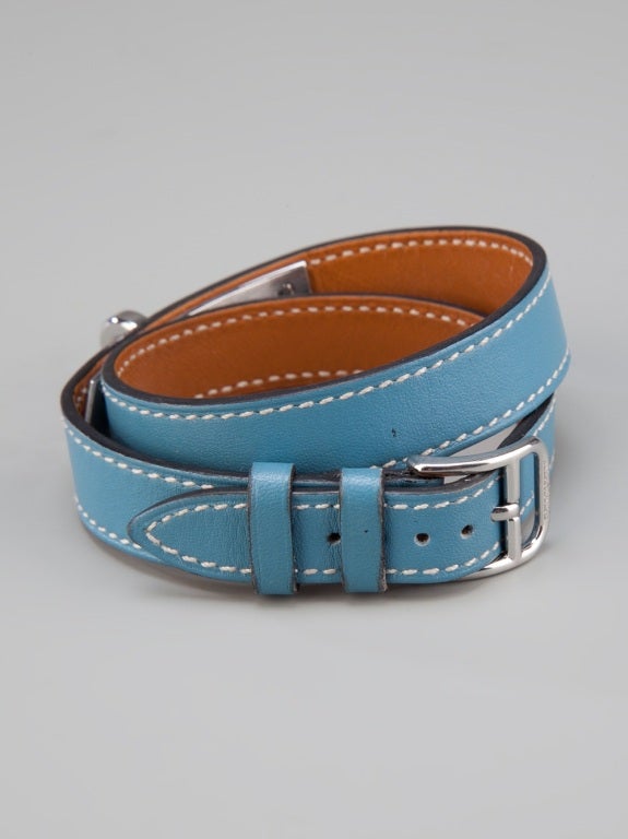 Vintage Hermes blue leather bracelet featuring silver-tone buckle fastening and silver-tone hardware. 

Stamp: L (2008)