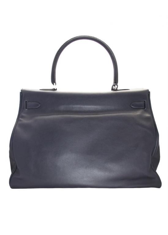 This Hermes Kelly Relax is in a pristine condition and brand-new with all original features. The palladium hardware is still in plastic; Hermès-Paris is embossed in silver on the bag, including 4 silver feet on the bottom of the bag. This bag comes