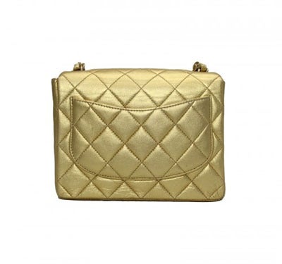 This is a fabulous gold mini Chanel shoulder bag, featuring a chain and leather long strap and double C turn-lock logo. This is a must-have evening bag and the perfect way to add a touch of glamour to your outfit. Wear with your favourite LBD!