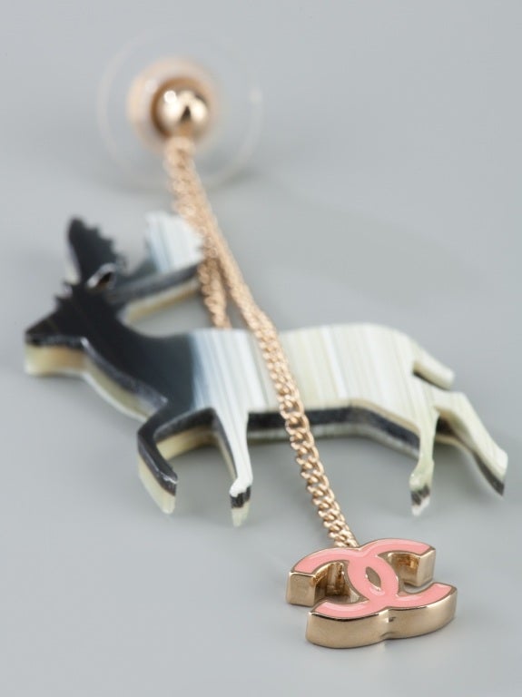 Chanel vintage reindeer earrings featuring a drop chain with a double C gold and pink logo.