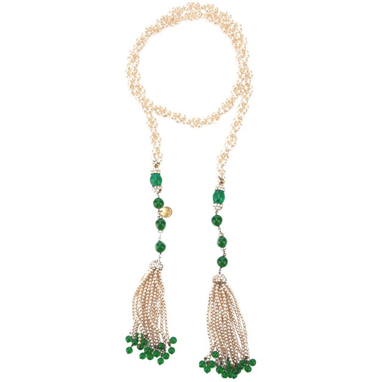 Pearl and Gripoix Limited Edition vintage Chanel necklace featuring embellished pearl tassels and diamante accents. This is an extremely rare Chanel piece that can be worn as a belt or necklace.


Returns Policy: Final Sale - No Returns.

All