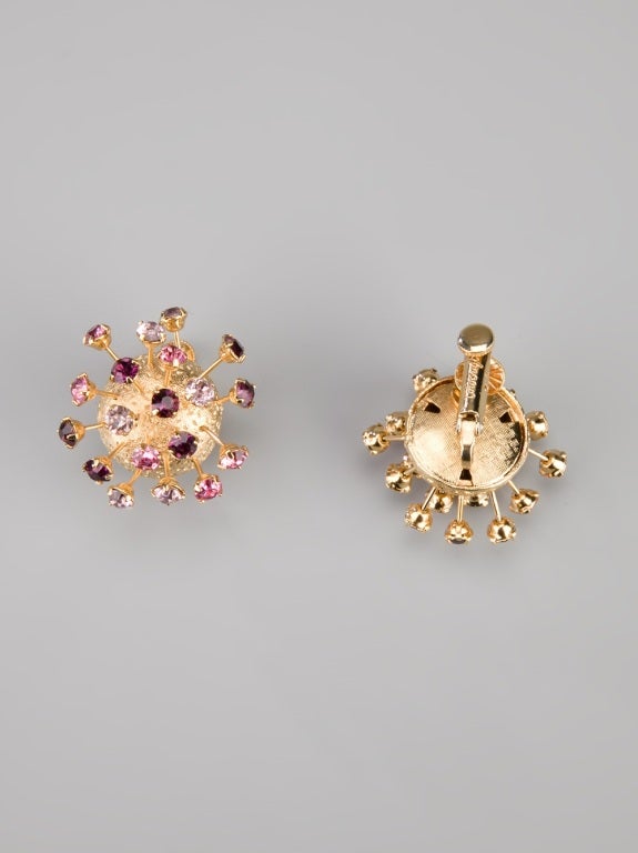 Gold-plated metallic earrings from the 1950s boasting a sphere design with pink and purple spiked crystals and clip-on fastenings.

Returns Policy: Final Sale - No Returns.

All of our items are shipped from the UK, as a result you may be liable