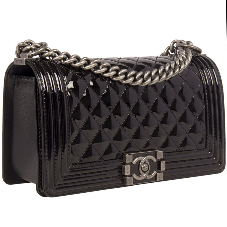Chanel boy flap bag in patent leather with gunmetal hardware. The interior is lined with black nylon and features one open pocket. This bag is in pristine condition and comes with all original packaging. 


Returns Policy: Final Sale - No