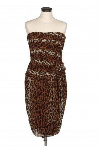 Vintage 1980s leopard print bandeau dress by Lilie Rubin. Features a pleated bodice, draping in the skirt and a ruffled flower applique at waist.

Returns Policy: Final Sale - No Returns.

All of our items are shipped from the UK, as a result