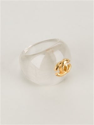 Vintage clear acrylic ring by Chanel, accented with a gold-toned CC logo at the front. 

Material: Acrylic

Measurements: circumference: 5.2cm

Returns Policy: Final Sale - No Returns.

All of our items are shipped from the UK, as a result
