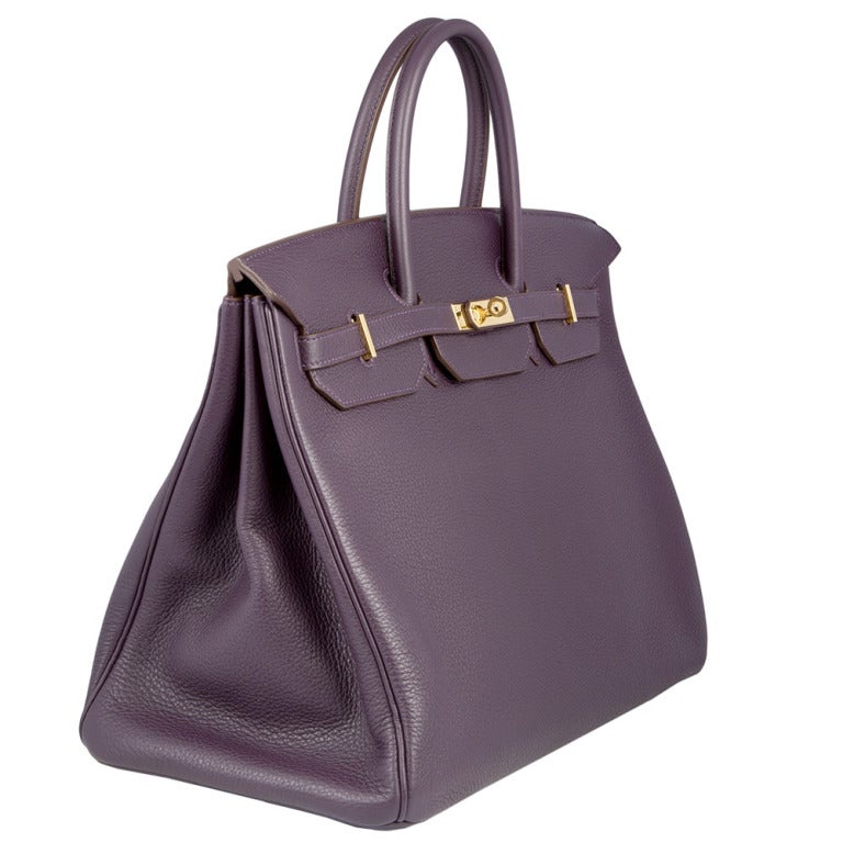 40cm Hermes Birkin Bag in Plum Togo Leather with gold-plated hardware. This bag has interior open pocket and one interior zip pocket. This bag comes with its original protective felt, dust bag, lock and key and raincoat.

Year: 2008

This bag is