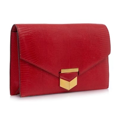 Hermes rare clutch bag in lizard skin featuring gold- tone hardware. This bag is lined with red leather and has one interior zipped pocket and two open pockets.

Material: Lizard skin, gold- plated metal

Measurements: W: 26cm H: 17cm D: 2.5cm