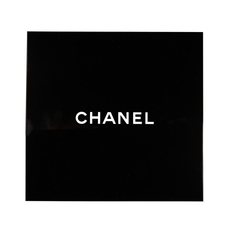Brand new 100% silk scarf from Chanel. Featuring a abstract print and the double 'C' logo. This scarf comes in it's original box.