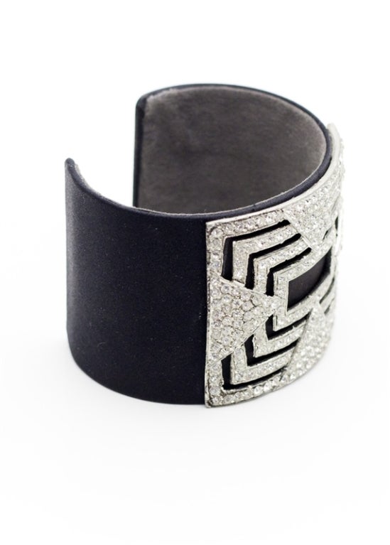 his is a chic black, satin, vintage cuff featuring a sleek crystal design and a soft suede interior. A beautiful and eye-catching piece. This beautiful cuff was handmade in the 1920's and is a complete one of a kind!

Returns Policy: Final Sale -