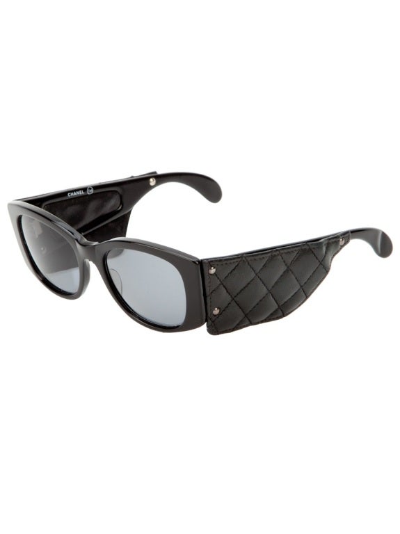 These Chanel Vintage sunglasses boast a classic design, enlivened with an edgy leather quilted sides. These sunglasses come with a branded Chanel case and both the items are in great condition.

Returns Policy: Final Sale - No Returns.

All of