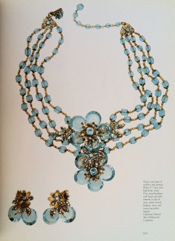 Fine vintage Miriam Haskell prototype brooch. Brooch similar to suite prominently featured in The Jewels of Miriam Haskell book (Deanna Farneti Cera) page 163. Signed plated metal item features faux aquamarine crystal 'petals', fauz pearls and