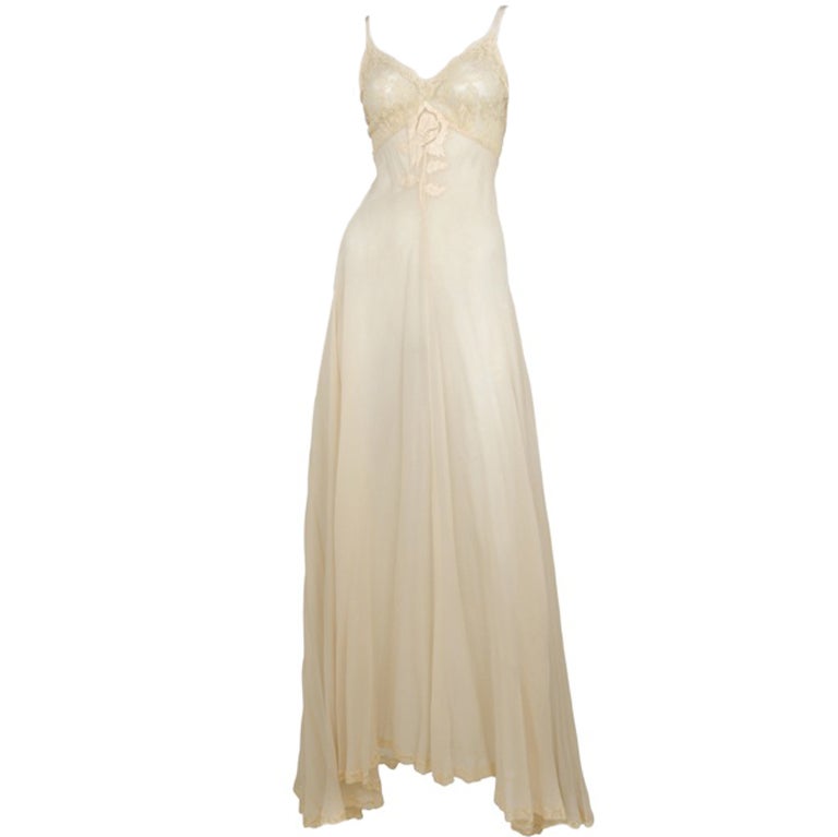 White chiffon with ivory lace bust gown and rose applique at center.