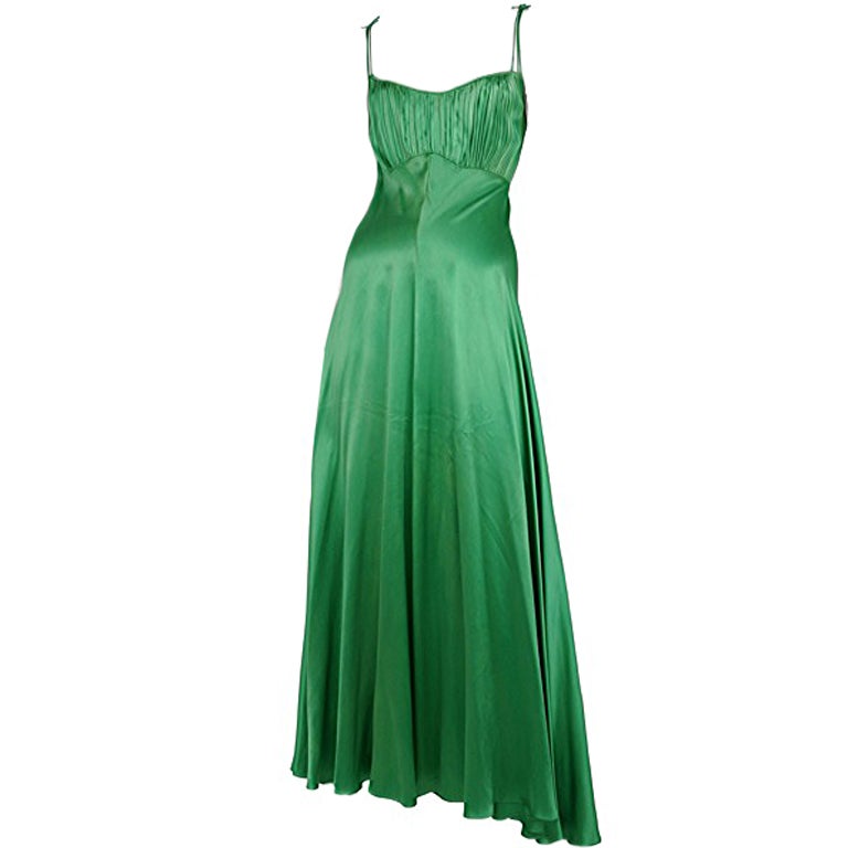 Emerald green satin gown with soft gathering detail at bust.