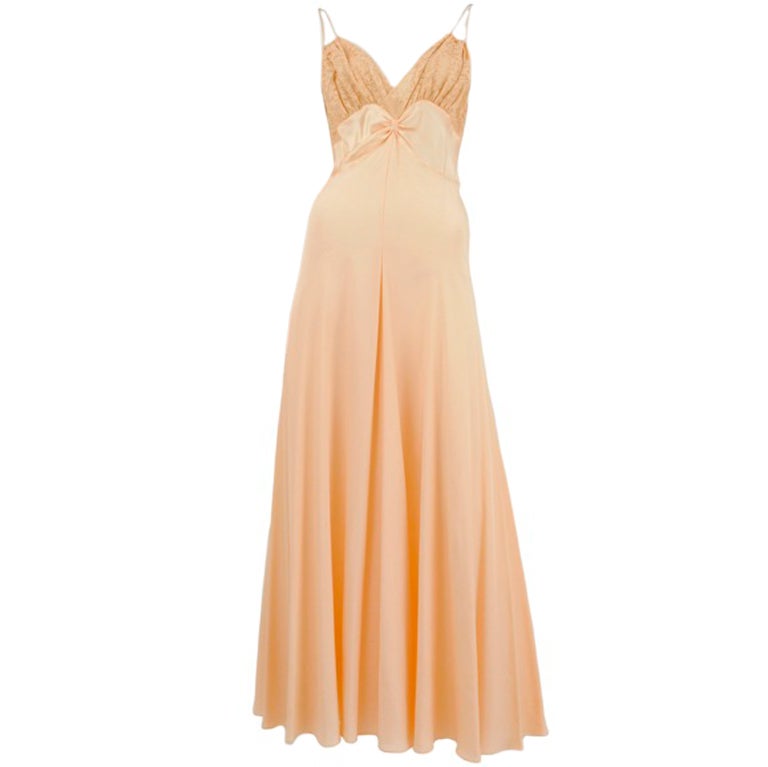 Soft peach silk crepe gown with delicate beige lace bodice and tiny gathers at waist.